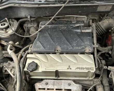 Черный Мицубиси Аутлендер, объемом двигателя 2.4 л и пробегом 258 тыс. км за 5400 $, фото 7 на Automoto.ua