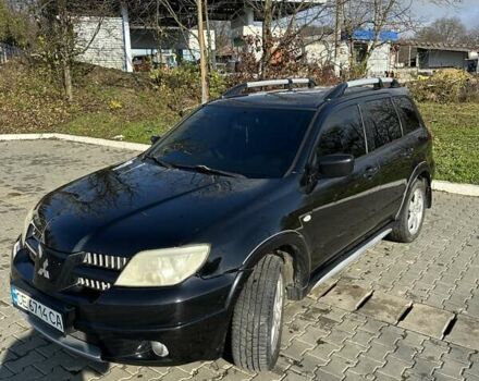 Черный Мицубиси Аутлендер, объемом двигателя 2.4 л и пробегом 307 тыс. км за 5600 $, фото 1 на Automoto.ua