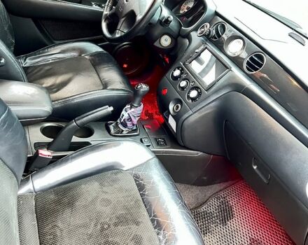 Чорний Міцубісі Аутлендер, об'ємом двигуна 2 л та пробігом 295 тис. км за 7500 $, фото 7 на Automoto.ua