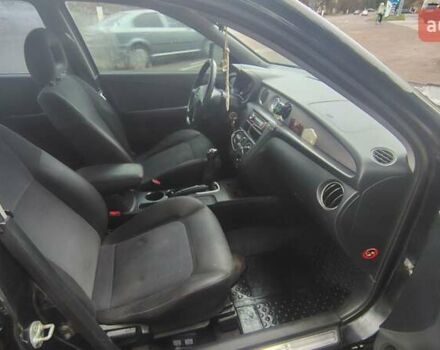 Черный Мицубиси Аутлендер, объемом двигателя 2 л и пробегом 330 тыс. км за 4997 $, фото 12 на Automoto.ua