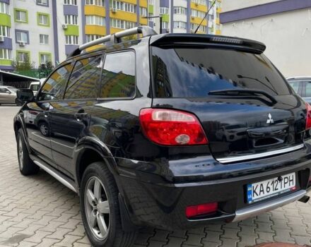 Черный Мицубиси Аутлендер, объемом двигателя 2.38 л и пробегом 270 тыс. км за 5900 $, фото 1 на Automoto.ua