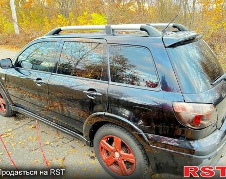 Черный Мицубиси Аутлендер, объемом двигателя 2 л и пробегом 295 тыс. км за 7500 $, фото 5 на Automoto.ua