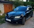 Черный Мицубиси Аутлендер, объемом двигателя 2.4 л и пробегом 260 тыс. км за 5900 $, фото 1 на Automoto.ua