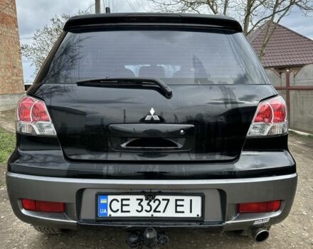 Черный Мицубиси Аутлендер, объемом двигателя 2.4 л и пробегом 258 тыс. км за 5400 $, фото 3 на Automoto.ua