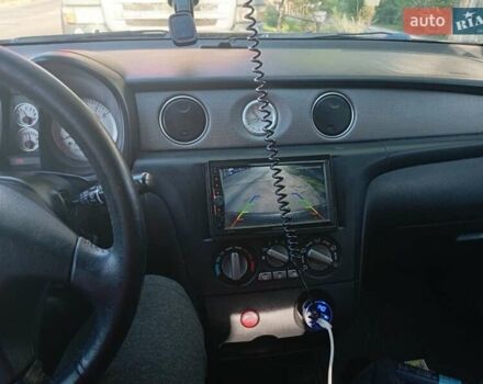Чорний Міцубісі Аутлендер, об'ємом двигуна 2 л та пробігом 274 тис. км за 5300 $, фото 8 на Automoto.ua