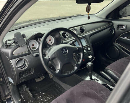 Чорний Міцубісі Аутлендер, об'ємом двигуна 2.38 л та пробігом 190 тис. км за 6800 $, фото 15 на Automoto.ua