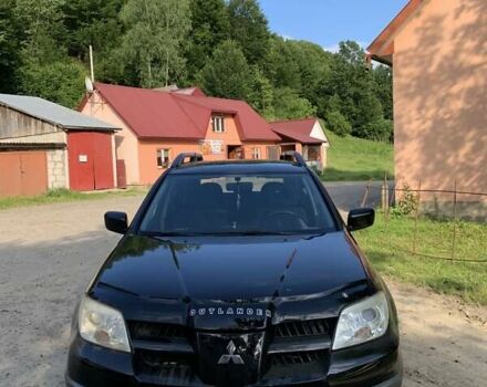 Чорний Міцубісі Аутлендер, об'ємом двигуна 2 л та пробігом 200 тис. км за 7000 $, фото 4 на Automoto.ua