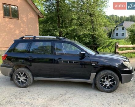 Чорний Міцубісі Аутлендер, об'ємом двигуна 2 л та пробігом 200 тис. км за 7000 $, фото 2 на Automoto.ua