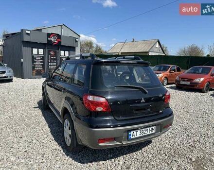 Черный Мицубиси Аутлендер, объемом двигателя 2.4 л и пробегом 204 тыс. км за 5390 $, фото 3 на Automoto.ua