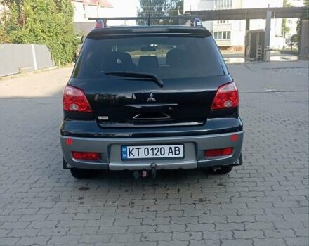 Черный Мицубиси Аутлендер, объемом двигателя 2 л и пробегом 297 тыс. км за 4550 $, фото 7 на Automoto.ua