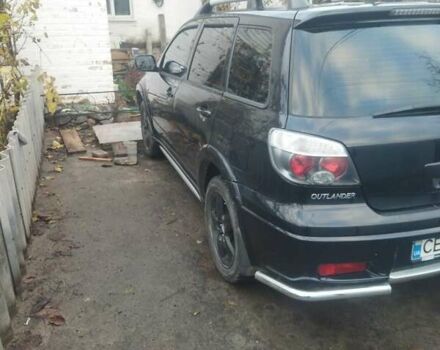 Черный Мицубиси Аутлендер, объемом двигателя 2.4 л и пробегом 280 тыс. км за 5455 $, фото 3 на Automoto.ua