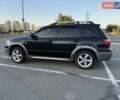 Черный Мицубиси Аутлендер, объемом двигателя 2 л и пробегом 158 тыс. км за 6700 $, фото 5 на Automoto.ua