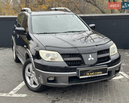 Черный Мицубиси Аутлендер, объемом двигателя 2.4 л и пробегом 242 тыс. км за 6800 $, фото 3 на Automoto.ua