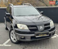 Черный Мицубиси Аутлендер, объемом двигателя 2.4 л и пробегом 242 тыс. км за 6800 $, фото 3 на Automoto.ua