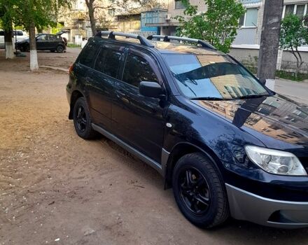 Черный Мицубиси Аутлендер, объемом двигателя 2 л и пробегом 226 тыс. км за 7000 $, фото 2 на Automoto.ua