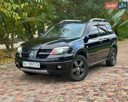 Чорний Міцубісі Аутлендер, об'ємом двигуна 2.38 л та пробігом 247 тис. км за 5499 $, фото 40 на Automoto.ua