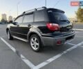 Черный Мицубиси Аутлендер, объемом двигателя 2 л и пробегом 158 тыс. км за 6700 $, фото 2 на Automoto.ua