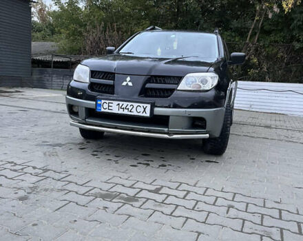 Черный Мицубиси Аутлендер, объемом двигателя 2 л и пробегом 280 тыс. км за 4999 $, фото 11 на Automoto.ua