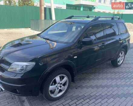 Черный Мицубиси Аутлендер, объемом двигателя 2 л и пробегом 212 тыс. км за 6000 $, фото 7 на Automoto.ua