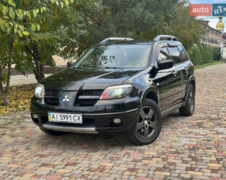 Чорний Міцубісі Аутлендер, об'ємом двигуна 2.38 л та пробігом 247 тис. км за 5499 $, фото 2 на Automoto.ua