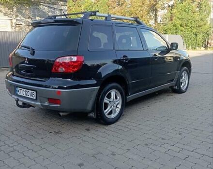 Черный Мицубиси Аутлендер, объемом двигателя 2 л и пробегом 297 тыс. км за 4550 $, фото 3 на Automoto.ua