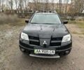 Чорний Міцубісі Аутлендер, об'ємом двигуна 2.4 л та пробігом 220 тис. км за 4300 $, фото 1 на Automoto.ua