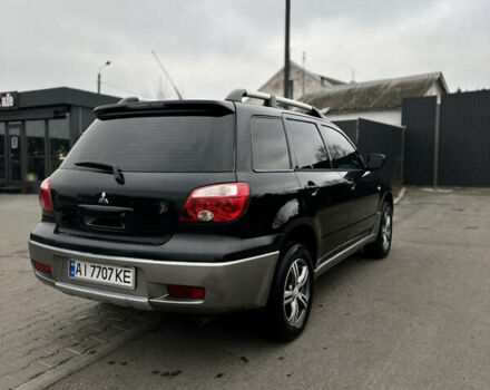 Чорний Міцубісі Аутлендер, об'ємом двигуна 2 л та пробігом 297 тис. км за 6200 $, фото 7 на Automoto.ua