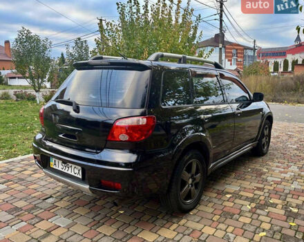 Чорний Міцубісі Аутлендер, об'ємом двигуна 2.38 л та пробігом 247 тис. км за 5499 $, фото 25 на Automoto.ua