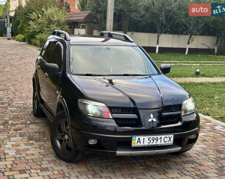 Чорний Міцубісі Аутлендер, об'ємом двигуна 2.38 л та пробігом 247 тис. км за 5499 $, фото 35 на Automoto.ua