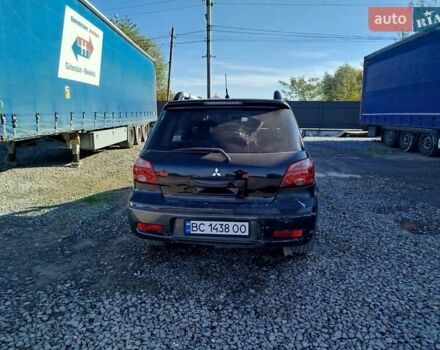 Чорний Міцубісі Аутлендер, об'ємом двигуна 2.38 л та пробігом 307 тис. км за 4600 $, фото 9 на Automoto.ua