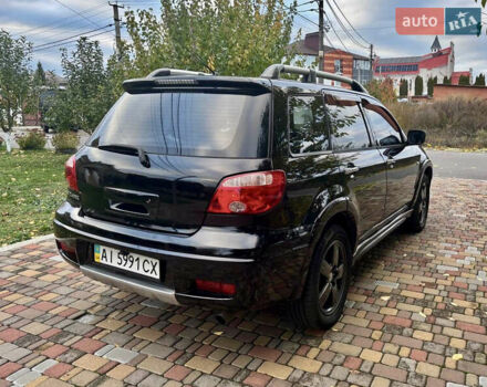 Чорний Міцубісі Аутлендер, об'ємом двигуна 2.38 л та пробігом 247 тис. км за 5499 $, фото 23 на Automoto.ua