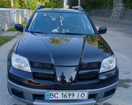 Чорний Міцубісі Аутлендер, об'ємом двигуна 2.38 л та пробігом 240 тис. км за 6300 $, фото 7 на Automoto.ua
