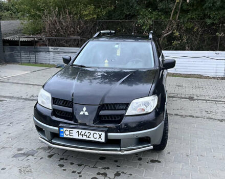 Черный Мицубиси Аутлендер, объемом двигателя 2 л и пробегом 280 тыс. км за 4999 $, фото 12 на Automoto.ua