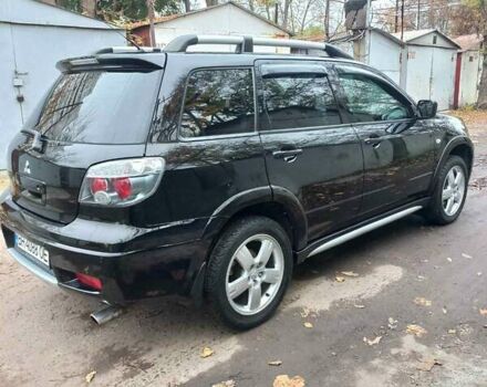 Черный Мицубиси Аутлендер, объемом двигателя 2.4 л и пробегом 256 тыс. км за 6900 $, фото 5 на Automoto.ua