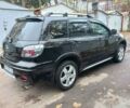 Черный Мицубиси Аутлендер, объемом двигателя 2.4 л и пробегом 256 тыс. км за 6900 $, фото 5 на Automoto.ua