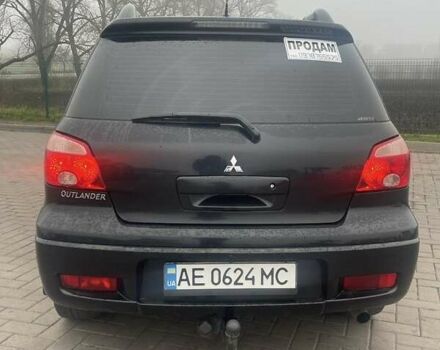 Черный Мицубиси Аутлендер, объемом двигателя 2.4 л и пробегом 277 тыс. км за 6700 $, фото 4 на Automoto.ua
