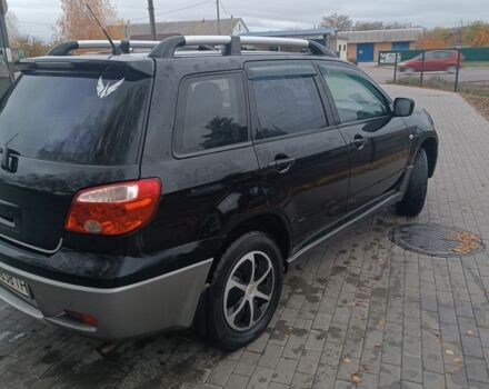 Чорний Міцубісі Аутлендер, об'ємом двигуна 2 л та пробігом 260 тис. км за 5400 $, фото 1 на Automoto.ua