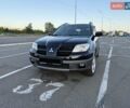 Черный Мицубиси Аутлендер, объемом двигателя 2 л и пробегом 158 тыс. км за 6700 $, фото 8 на Automoto.ua