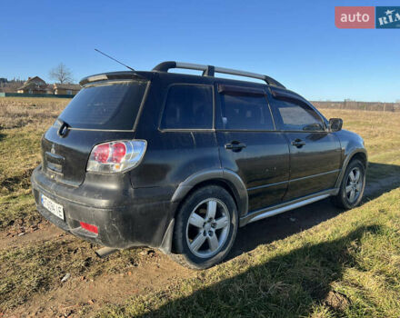 Черный Мицубиси Аутлендер, объемом двигателя 2.38 л и пробегом 230 тыс. км за 5350 $, фото 3 на Automoto.ua