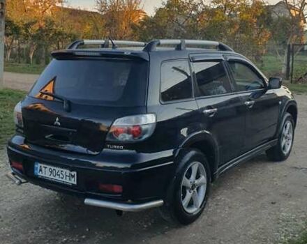 Міцубісі Аутлендер 2006 у Івано-Франківську на Automoto.ua Чорний Міцубісі Аутлендер, об'ємом двигуна 2 л та пробігом 263 тис. км за 7250 $, фото 14 на Automoto.ua