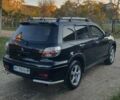 Міцубісі Аутлендер 2006 у Івано-Франківську на Automoto.ua Чорний Міцубісі Аутлендер, об'ємом двигуна 2 л та пробігом 263 тис. км за 7250 $, фото 14 на Automoto.ua