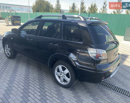 Черный Мицубиси Аутлендер, объемом двигателя 2 л и пробегом 212 тыс. км за 6000 $, фото 6 на Automoto.ua