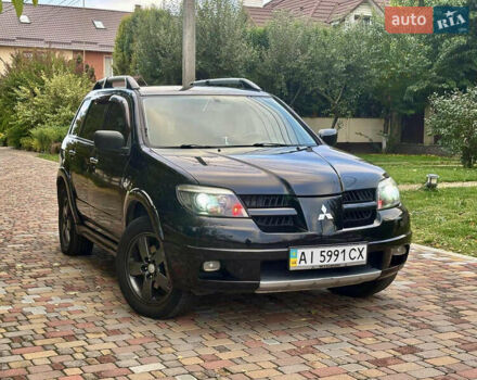 Чорний Міцубісі Аутлендер, об'ємом двигуна 2.38 л та пробігом 247 тис. км за 5499 $, фото 39 на Automoto.ua