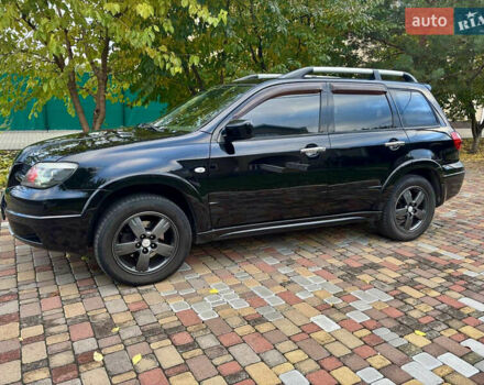 Чорний Міцубісі Аутлендер, об'ємом двигуна 2.38 л та пробігом 247 тис. км за 5499 $, фото 8 на Automoto.ua