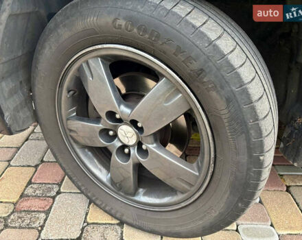 Чорний Міцубісі Аутлендер, об'ємом двигуна 2.38 л та пробігом 247 тис. км за 5499 $, фото 9 на Automoto.ua