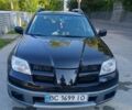 Чорний Міцубісі Аутлендер, об'ємом двигуна 2.38 л та пробігом 240 тис. км за 6300 $, фото 28 на Automoto.ua