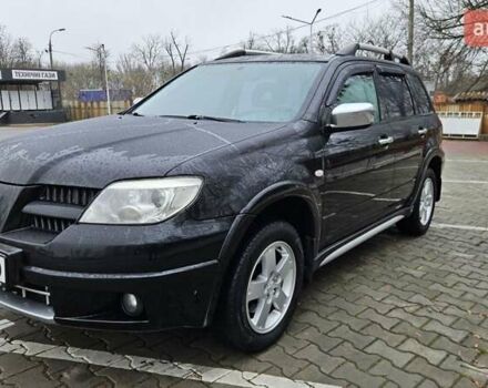 Черный Мицубиси Аутлендер, объемом двигателя 2.4 л и пробегом 167 тыс. км за 6150 $, фото 2 на Automoto.ua