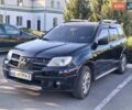 Чорний Міцубісі Аутлендер, об'ємом двигуна 2.38 л та пробігом 320 тис. км за 5600 $, фото 1 на Automoto.ua