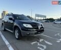 Черный Мицубиси Аутлендер, объемом двигателя 2 л и пробегом 158 тыс. км за 6700 $, фото 1 на Automoto.ua