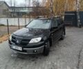 Чорний Міцубісі Аутлендер, об'ємом двигуна 2 л та пробігом 260 тис. км за 5400 $, фото 1 на Automoto.ua